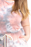 REBELLA WEEKEND VIBES, TIE-DYE, SLEEVELESS SHORTS, CURVY, PLUS SIZE ROMPER, IN BLUSH PINK, GRAY, AND WHITE- CLOSE UP VIEW OF DRAWSTRING WAIST AND POCKET